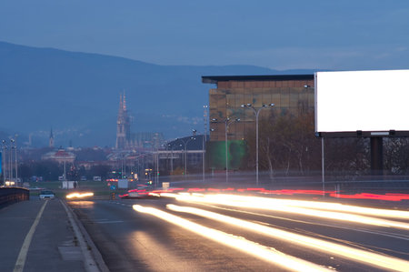 Long exposure of street in Zagreb with empty billboardの写真素材