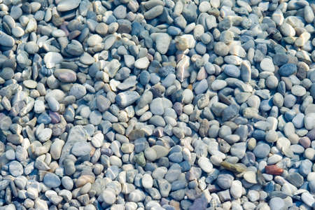 Pebbles background under water surfaceの写真素材