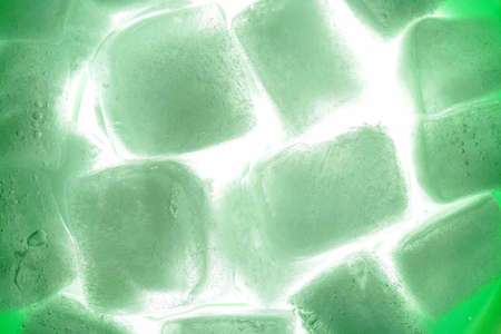 Green ice cubes as backgroundの写真素材