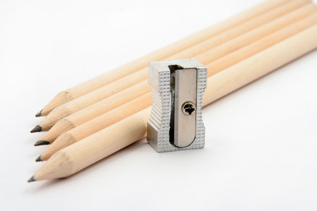 Pencils with pencil sharpener on white