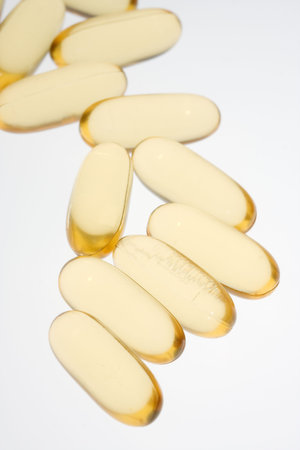 Yellow pills on blue background