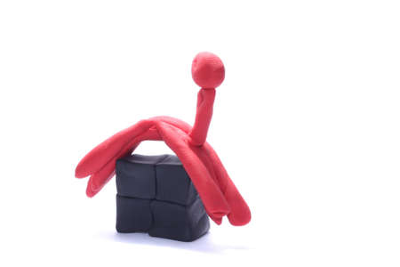Plasticine house with red roofの写真素材