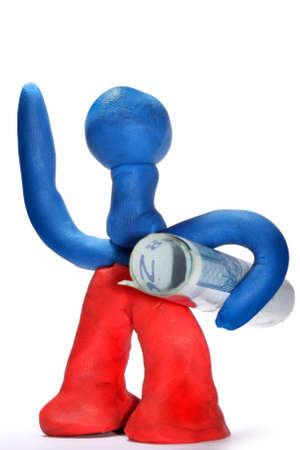 Plasticine toy man with twenty euro bill under armの写真素材
