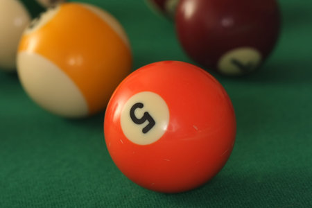 Close up of pool ball number 5