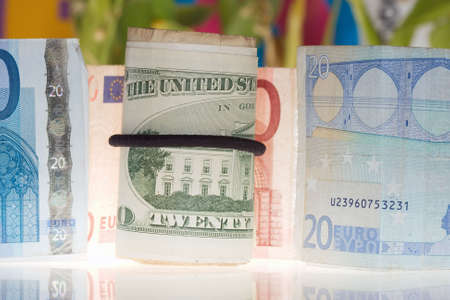 20 euro bill aside of bundle of 20 dollar billsの写真素材