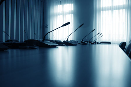 Close up of empty boardroom meeting area with blue light on