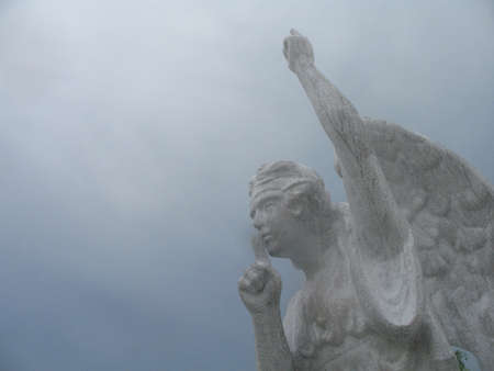 Angel asking silence in a graveyard at Holbox Mexico.の素材