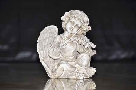 Figurine of an angel playing the violinの写真素材