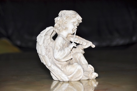 Figurine of an angel playing the violinの写真素材