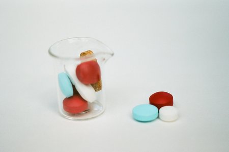 Pills in small beakerの写真素材