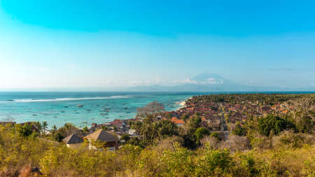 Jungutbatu Village with Mount Agung in the Background, Lembongan, Indonesiaの写真素材