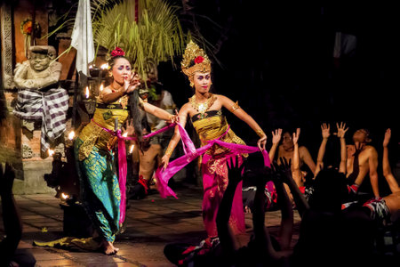 Denpasar, Bali, Indonesia - September 9th, 2014: Female Dancers Performing Traditional Balinese Dance Kecak Accompanied by Male Voice Choir during Hindu Ceremony in Small Village Near Denpasar.のeditorial素材