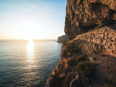 A Stairway Cut into the Cliff of Capo Caccia leading to Cave of Neptune (Grotte di Nettuno) near Alghero, Sardinia, Italyの写真素材