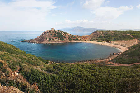 Porticciolo Beach with Ruins of Ancient Watchtower (Nuraghe) - Torre del Porticciolo near Alghero, Province of Sassari, Sardinia, Italyの写真素材