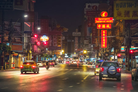 Bangkok, Thailand - December 26th 2016: Night Picture of Yaowarat Road in Samphanthawong district which is the Main Street in Bangkok's Chinatown with its Busy Traffic, Neon Signs, Restaurants and Street Food Stalls.のeditorial素材