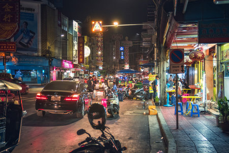Bangkok, Thailand - December 26th 2016: Night Picture of Yaowarat Road in Samphanthawong district which is the Main Street in Bangkok's Chinatown with its Busy Traffic, Neon Signs, Restaurants and Street Food Stalls.のeditorial素材