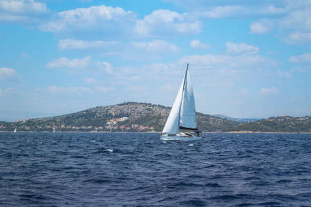 Sailboat under Full Sail at Adriatic Sea near the Island of Murter, Dalmatia, Croatiaの写真素材
