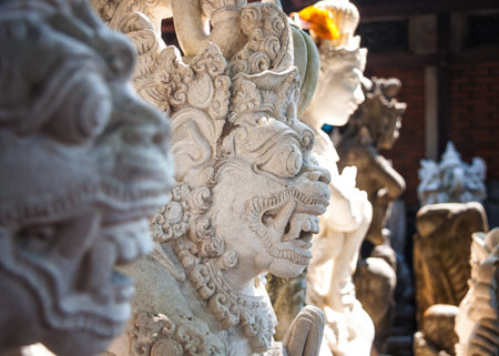 Balinese God Carved Stone Statue, Denpasar, Bali, Indonesiaの写真素材