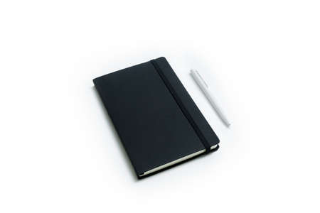 Notebook and white pen isolated on white backgroundの写真素材