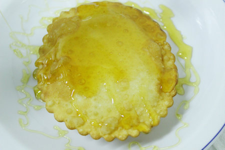 Seadas or Sebadas. Typical Sardinian desserts. Pancake filled with melted cheese served hot and...