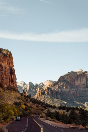 Incredible mountain view landscapes in the valley at Zion National Park in Utah United States. There are amazing colors of orange and yellows at all times of the day.の写真素材