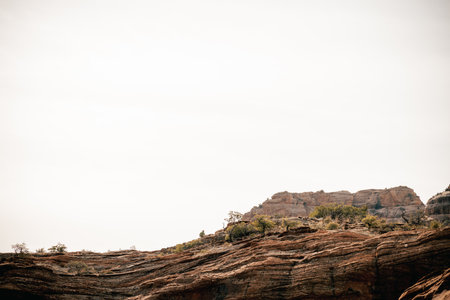 40s male hiker on ledge enjoys solitude above Boynton Canyon Sedonaの写真素材