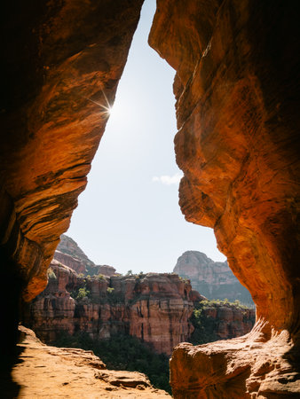 Secret Subway Cave Boynton Canyon Sedona Arizona United States of America with sunstar on top left.の写真素材