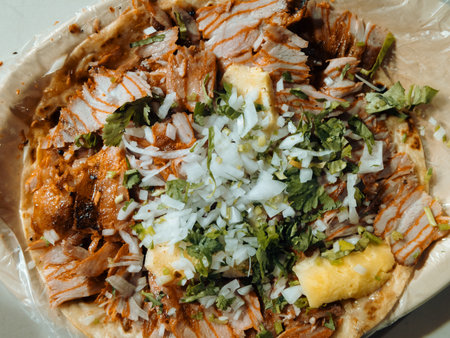 Top view of large plate Mexican al pastor street tacos with cilantro, onion, and pineapple.の写真素材
