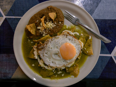 Typical chilaquiles mexican food for breakfast in Mexico. Top down view on table flat lay.の写真素材