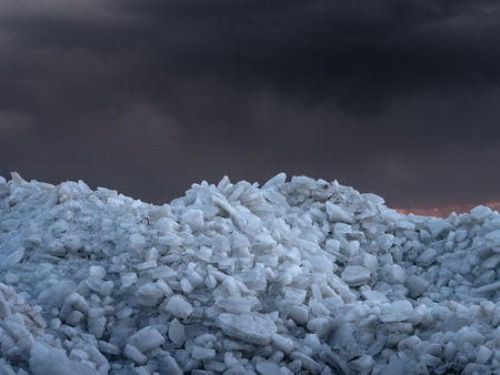 A pile of ice stacks on shoreline of Utah Lake on Vineyard Beach in Utah.の写真素材