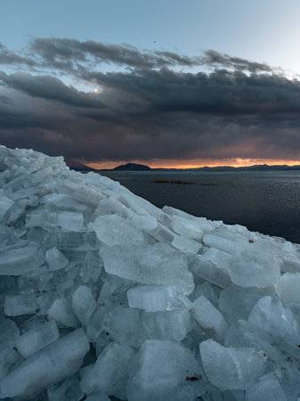 Ice stacks on Utah Lake during blue hour.の写真素材