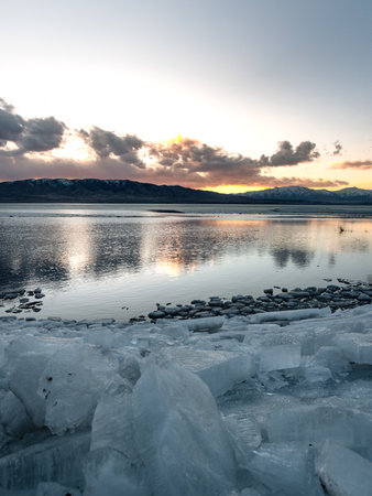 Ice stacks on Utah Lake during blue hour.の写真素材