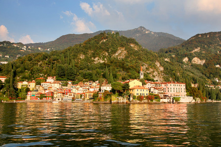 Colorful village of Varenna reflecting on the water of Lake Como Italyの写真素材