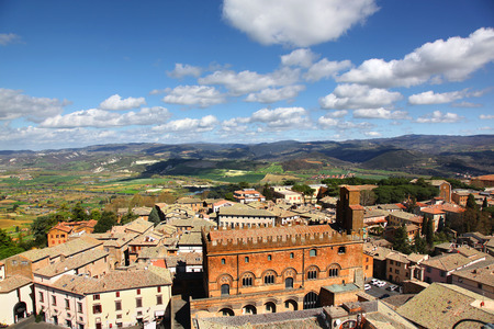 Aerial view of the roof tops and rolling green hills of Orvieto Italyの写真素材