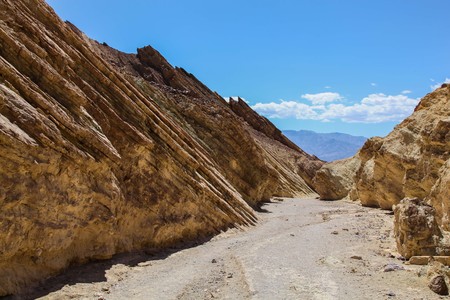 View down Golden Canyon Trail to mountains in the distance in Death Valley National Parkの写真素材