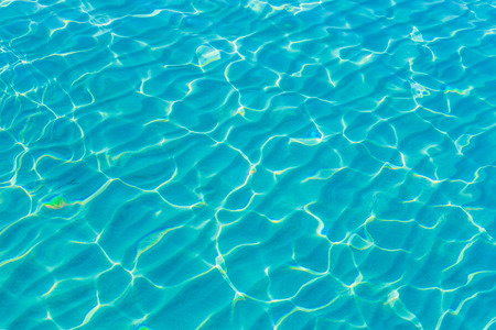 Clear blue sea with sand pattern