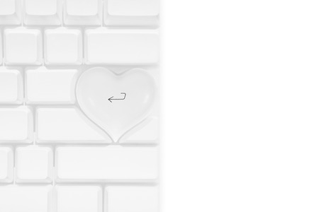 White apple computer keyboard with a love heart shaped return keyの写真素材