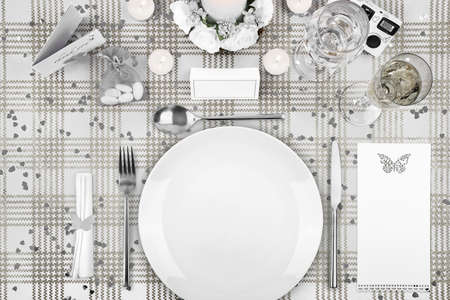 wedding day dinner table setting with a blank menu and name cardの写真素材