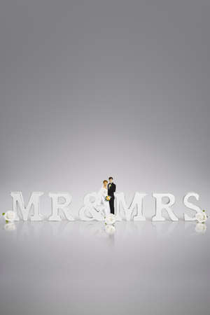 wedding day concept with bride and groom cake toppers & wooden mr&mrs signの写真素材