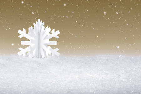 White Christmas snow flake decoration on fake white snowの写真素材