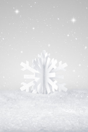 White Christmas snow flake decoration on fake white snowの写真素材