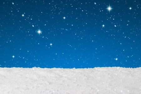 Christmas concept showing snow falling and stars on a backgroundの写真素材