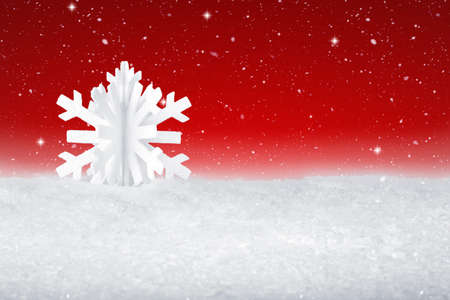 White Christmas snow flake decoration on fake white snowの写真素材
