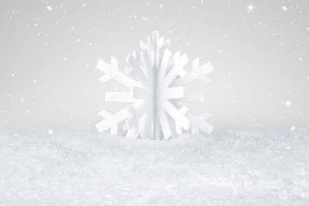 White Christmas snow flake decoration on fake white snowの写真素材
