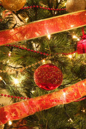 close up of Christmas Baubles on a illuminated Christmas treeの写真素材