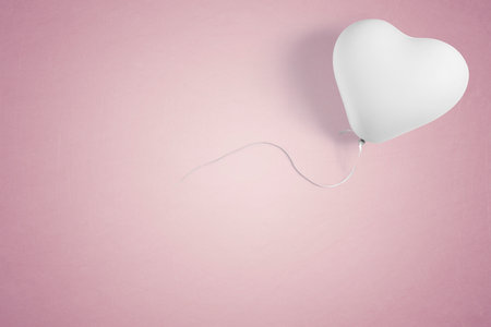 White heart shape party balloon with copy spaceの写真素材