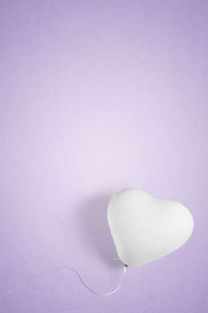 White heart shape party balloon with copy spaceの写真素材