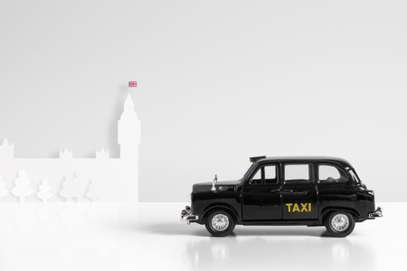 Black Model taxi & houses of parliament London conceptの写真素材