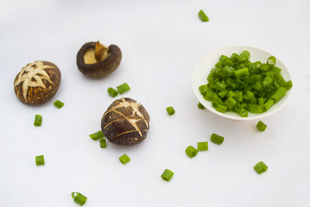 Mushrooms and green onionの写真素材