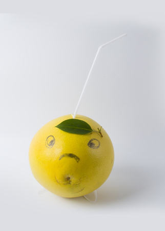 Grapefruit with smiley faceの写真素材